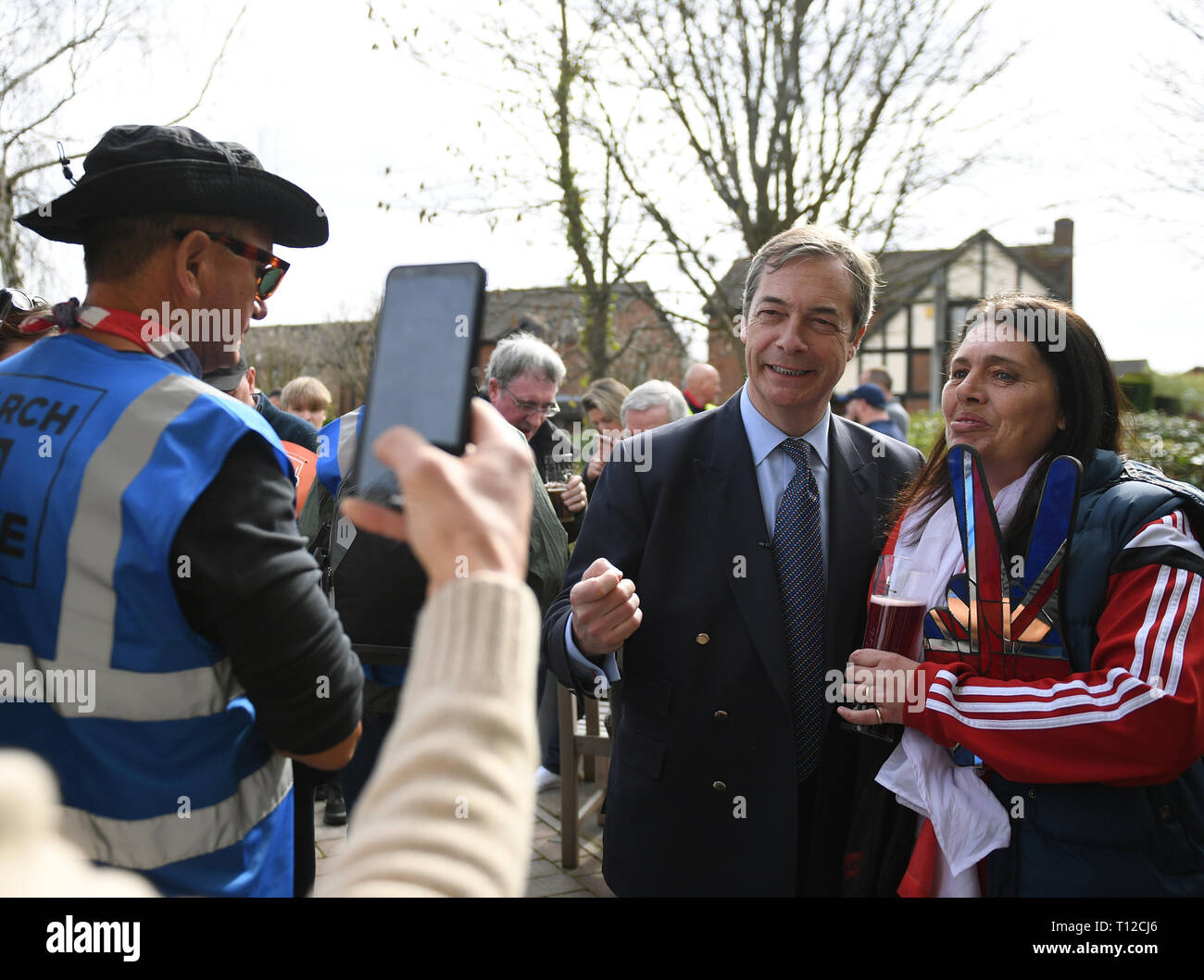 Former UKIP leader Nigel Farage poses for photos during the lunch break of the March to Leave protest in Nuthall, Nottingham on their way to London over a 14-day period, arriving in the capital on March 29, where a mass rally will take place on Parliament Square. Stock Photo