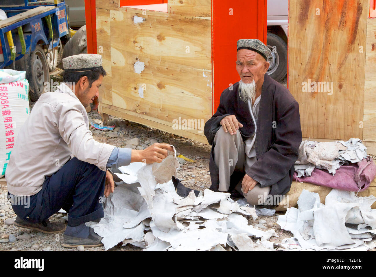 Selling leather at famous sunday market in Kashgar, Xinjiang Autonomous Region, China. Stock Photo