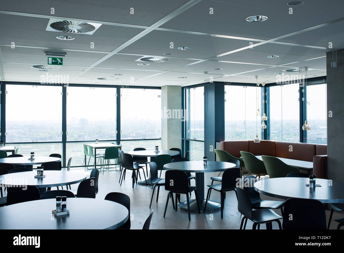 Inside a bright and airy modern restaurant in the UP office building in Amsterdam Holland Stock Photo