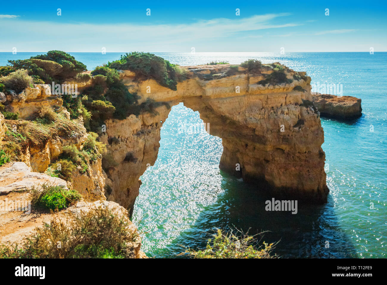 Natural arch above ocean, Arco de Albandeira, Algarve, Portugal Stock