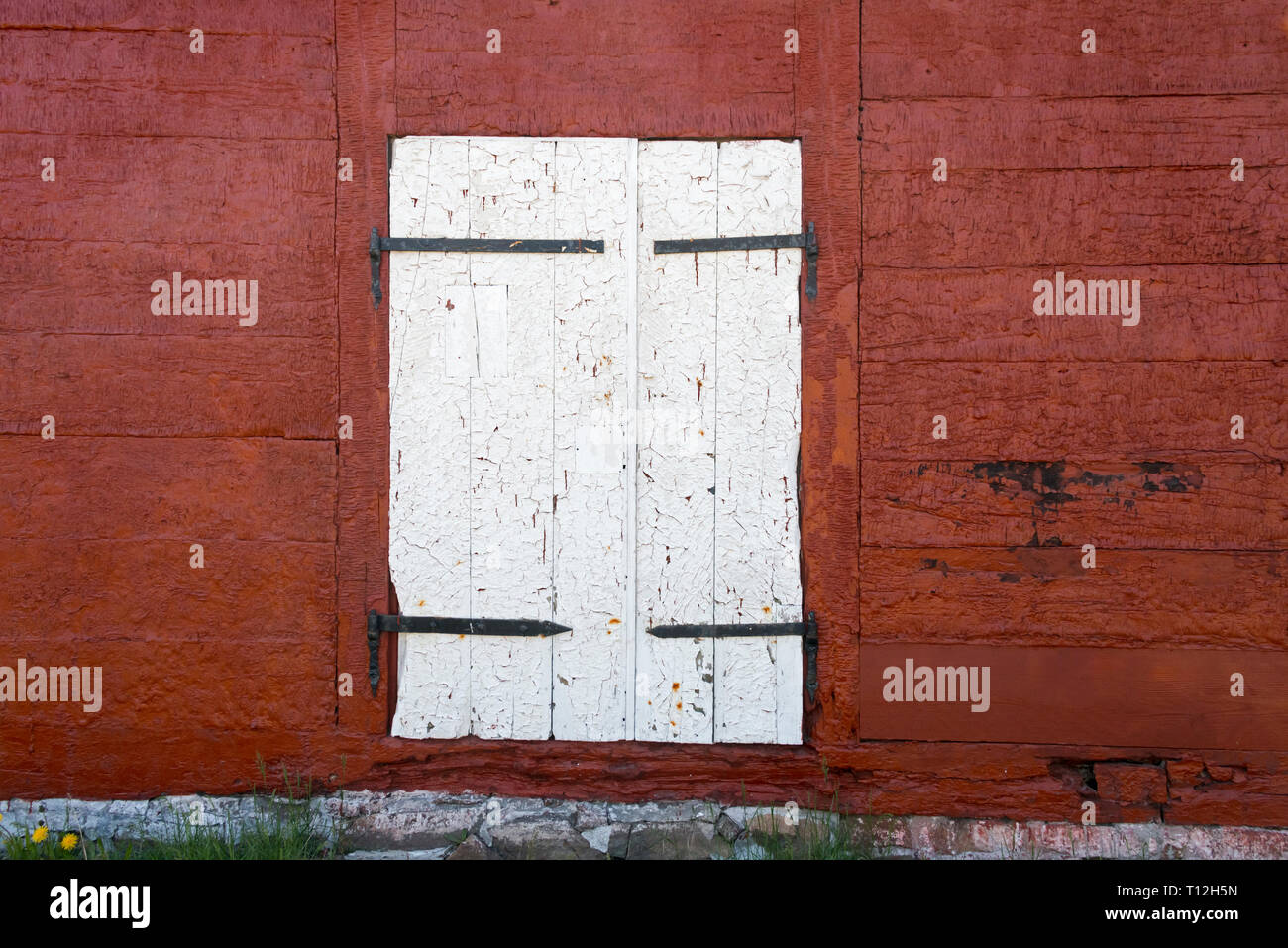 Paint on old warehouse door peeling, Sisimiut, Greenland Stock Photo