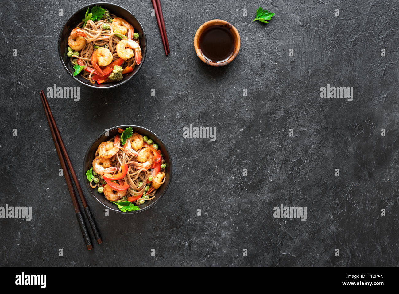 Stir fry with soba noodles, shrimps (prawns) and vegetables. Asian
