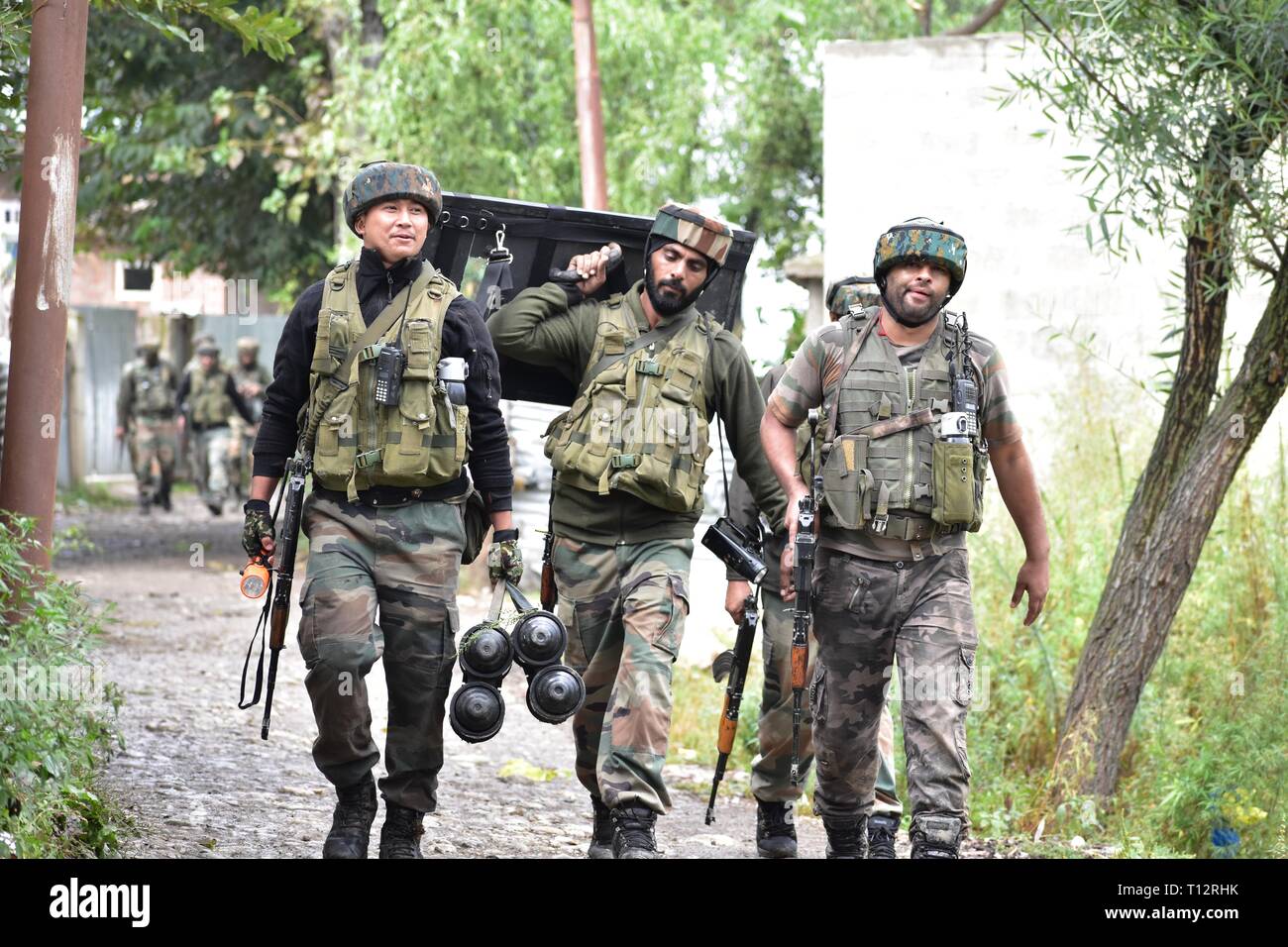 Indian Army and Para Commandos in an encounter site which erupted between  Militants & Security Men in South Kashmir's Qazigund on 15/09/2018,in which  Clashes erupted between youth and Police Stock Photo -