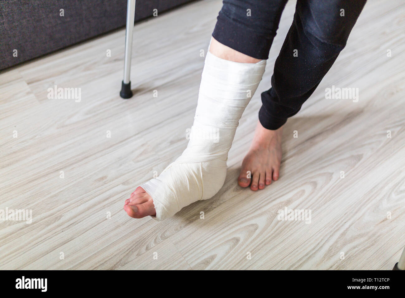 The man is trying to walk with a broken leg Stock Photo Alamy