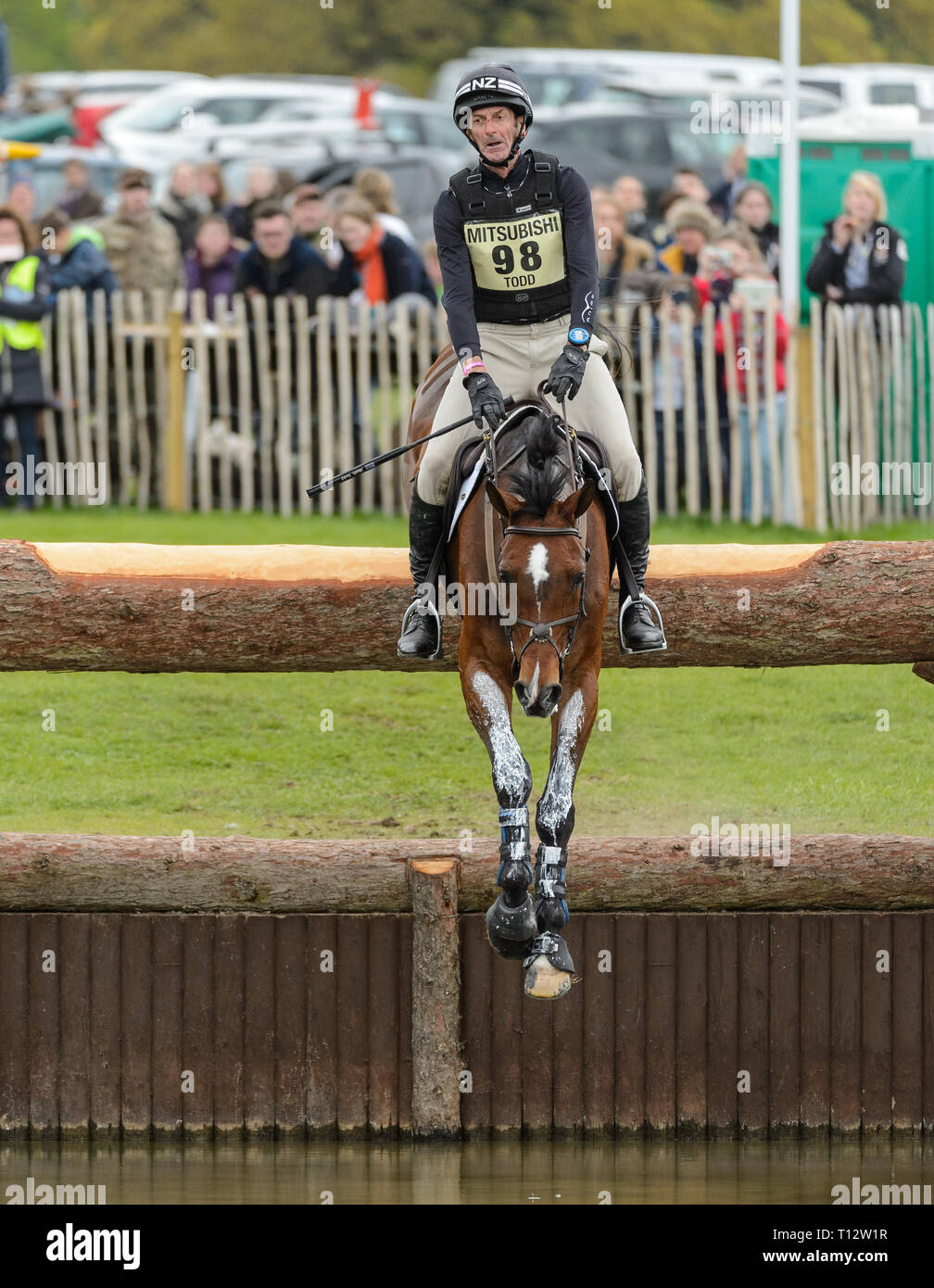 Mark Todd and NZB CAMPINO (NZL) jump into the lake - Cross Country - Mitsubishi Motors Badminton Horse Trials, Gloucestershire, May 2017 Stock Photo