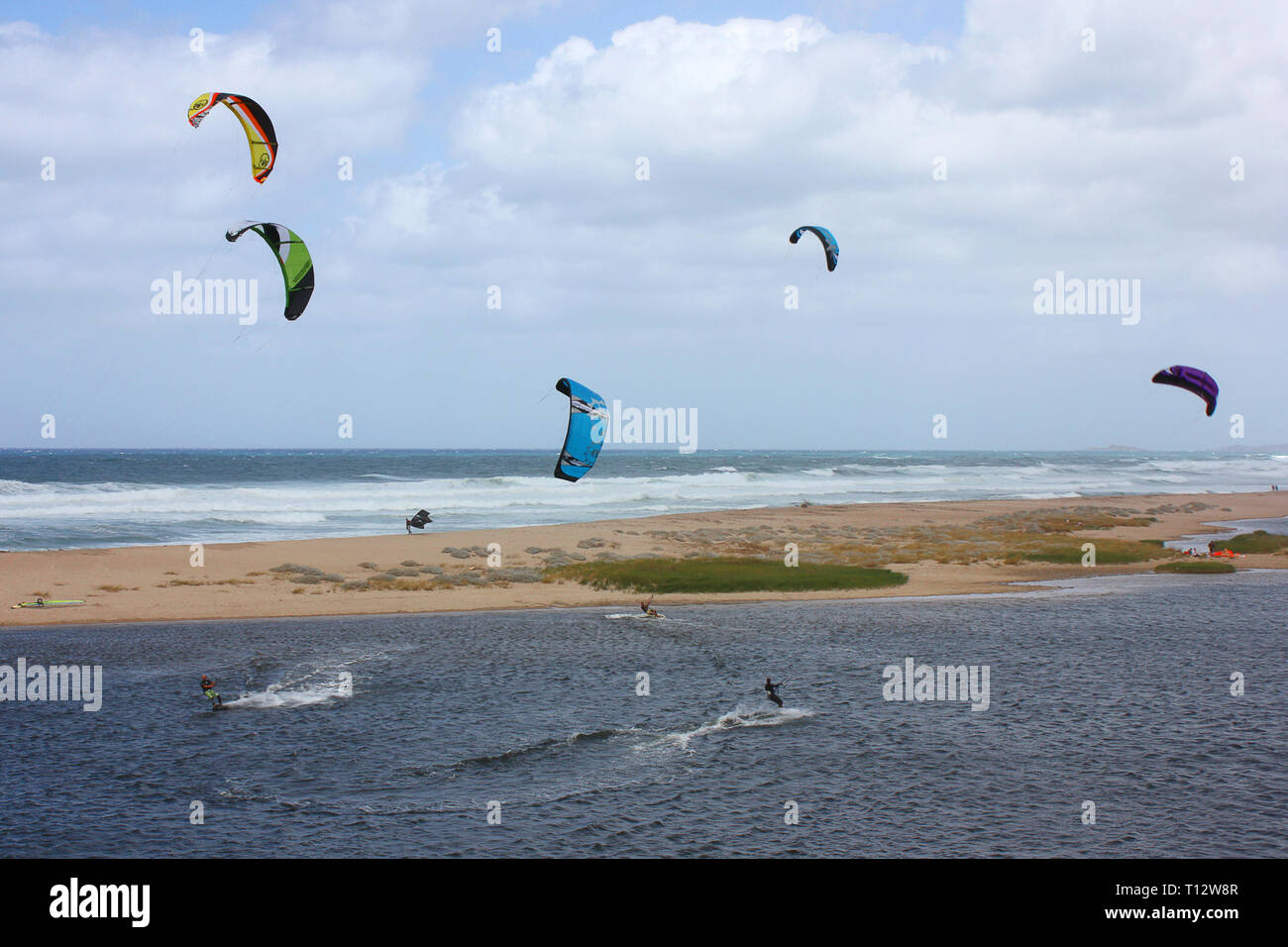 Kitesurfing on a sardinian beach Stock Photo