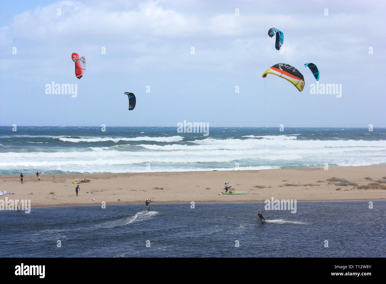 Kitesurfing on a sardinian beach Stock Photo