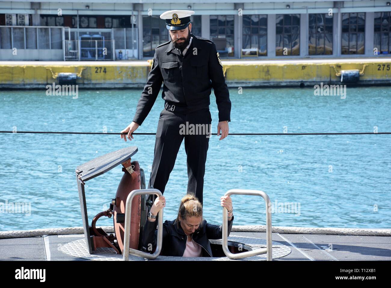 A visitor seen getting into the submarine Matrozos at Piraeus Port. Due to the Greek Independence Day Piraeus Port is open to the public, a national holiday celebrated annually in Greece on March 25, commemorating the start of the War of Greek’s Independence in 1821. Stock Photo