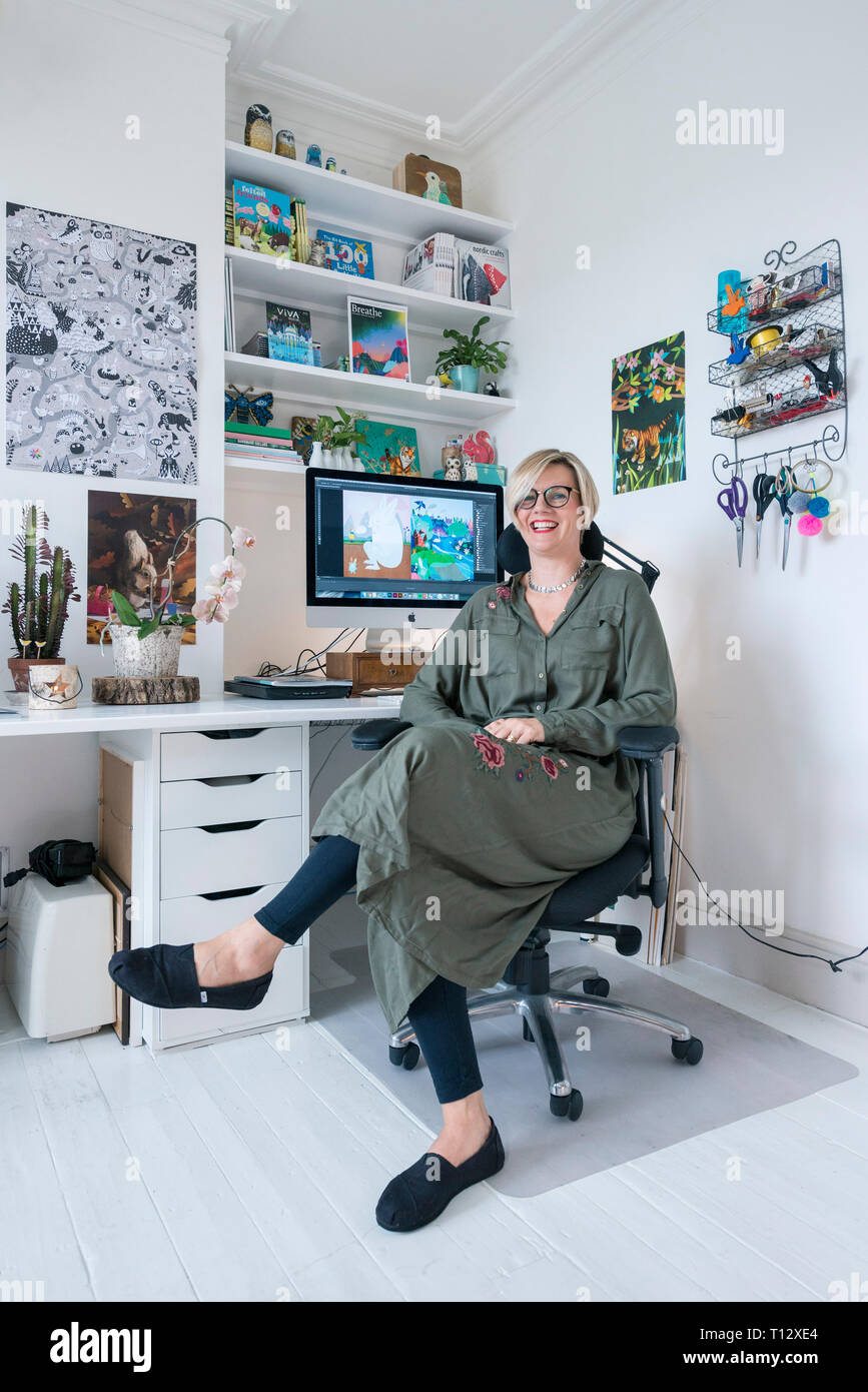 A Creative Artistic Illustrator Photographed In Their Interesting Studio Work Space At Their Desk Stock Photo Alamy