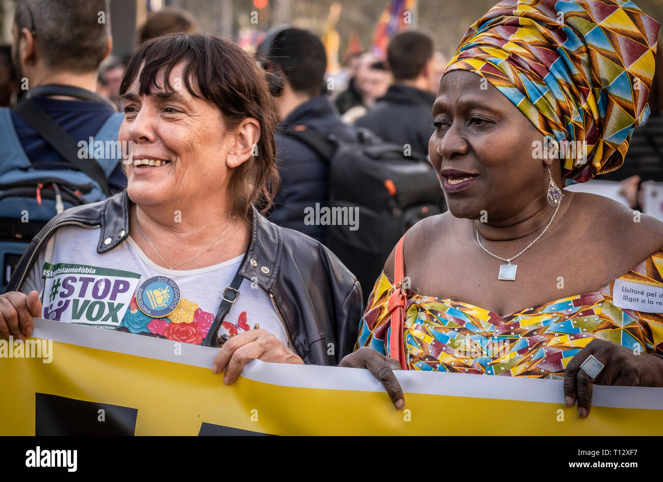 Women are seen holding a banner during the demonstration. Thousands of people have marched in Barcelona against fascism and racism. Supported by some 200 social organizations, trade unions and parties, framed in the International Day against Racism, the protest has been focused mainly against the new party of the Spanish right wing VOX already with parliamentary representation. Stock Photo