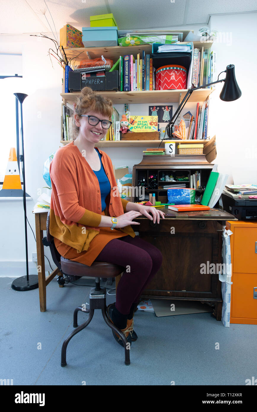 A Creative Artistic Illustrator Photographed In Their Interesting Studio Work Space At Their Desk Stock Photo Alamy