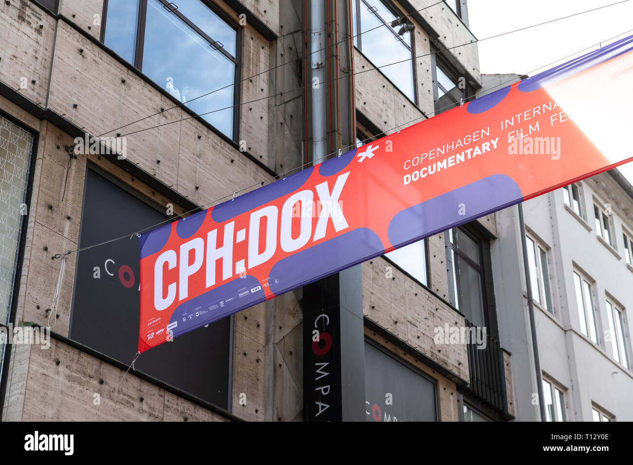 CPH:DOX, Copenhagen International Documentary Film Festival, banner between houses, Copenhagen, Denmark Stock Photo