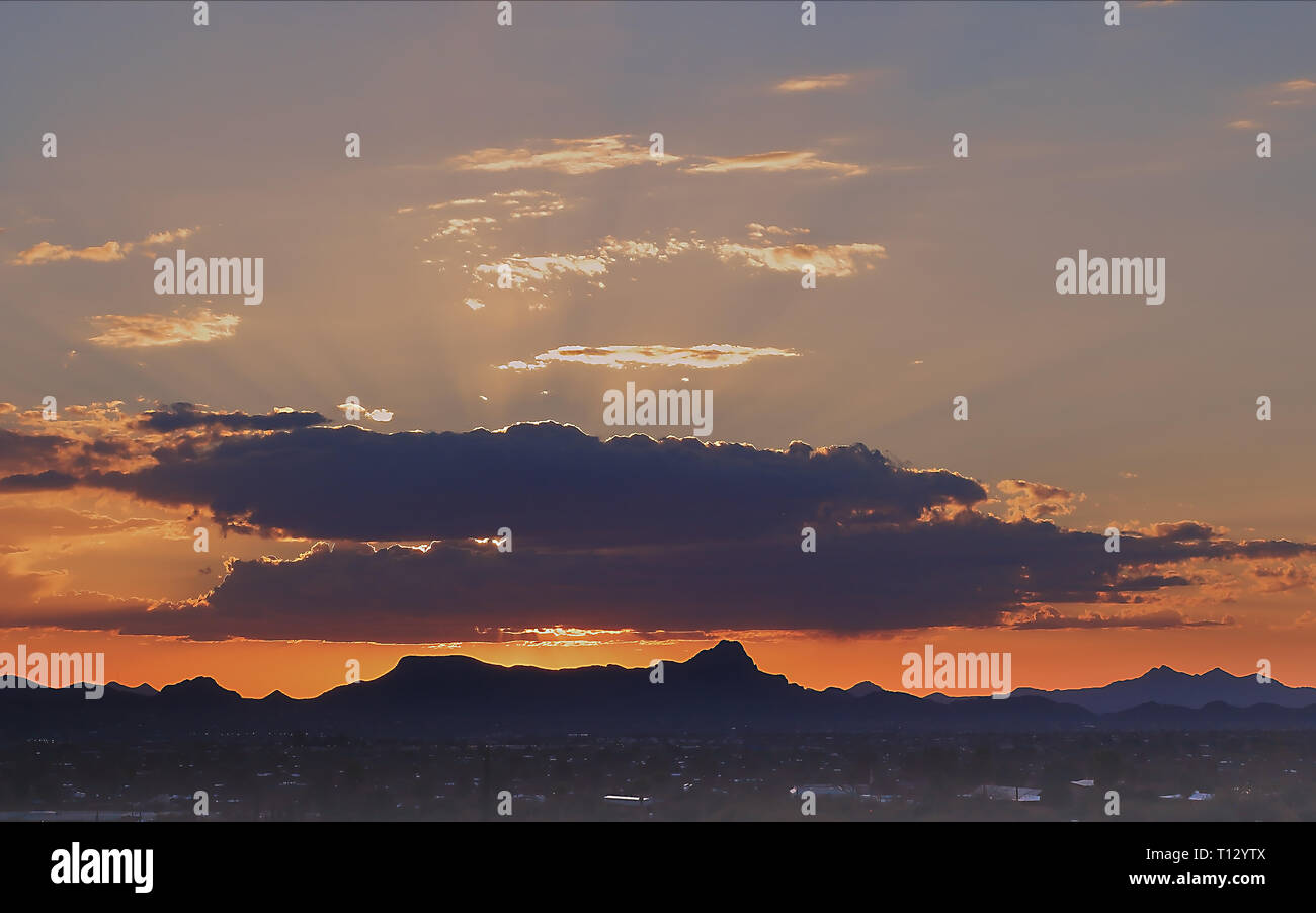Sunrays filtering through the clouds. Sunset in Tucson, Arizona Stock ...
