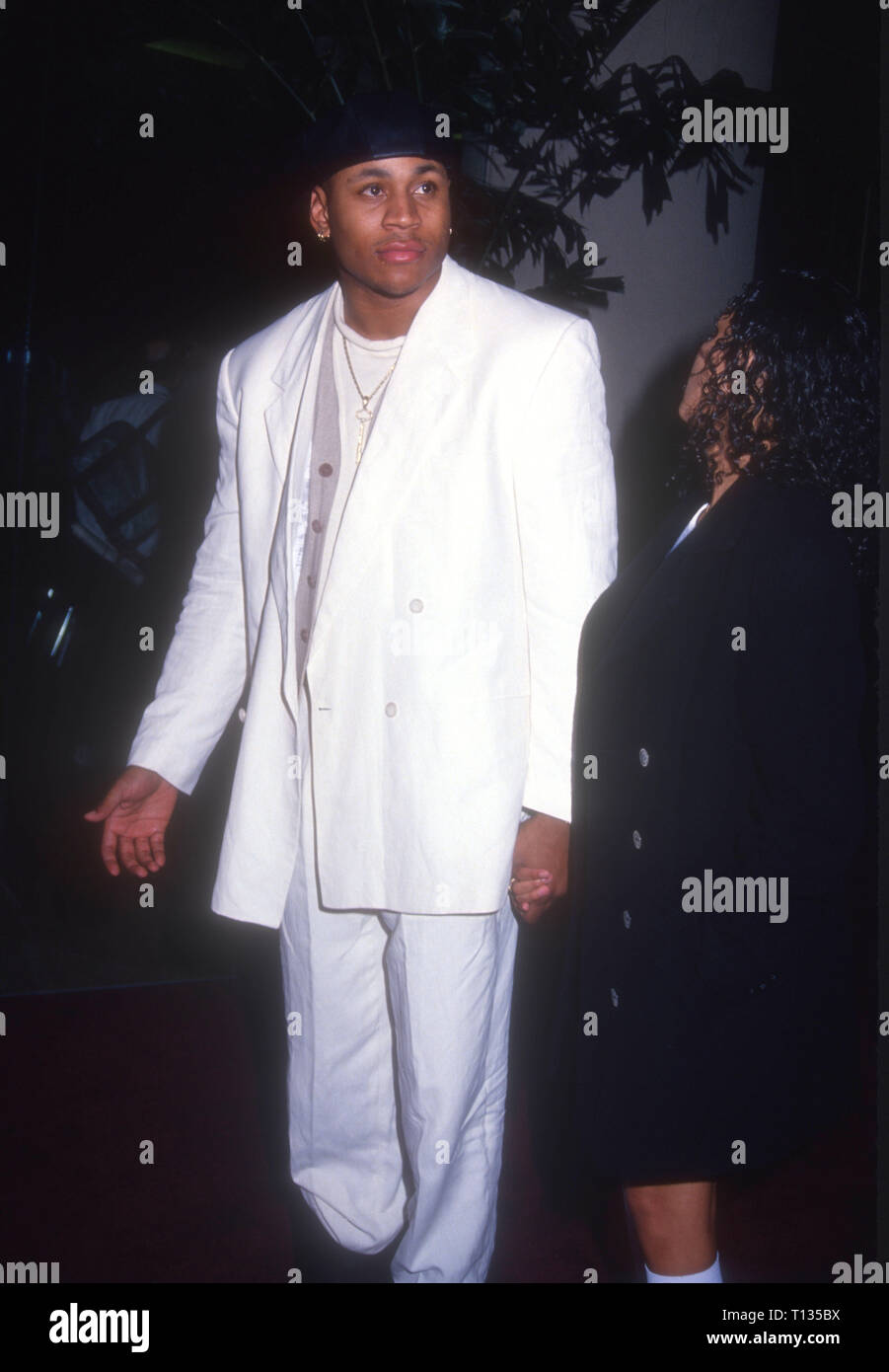 BEVERLY HILLS, CA - MARCH 3: Rapper/actor LL Cool J and actress Kidada Jones attend the 22nd Annual American Film Institute (AFI) Lifetime Achievement Award Salute to Jack Nicholson on March 3, 1994 at the Beverly Hilton Hotel in Beverly Hills, California. Photo by Barry King/Alamy Stock Photo Stock Photo