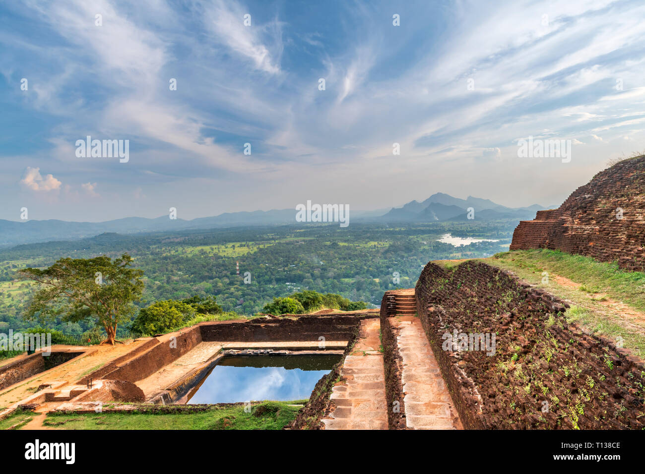 The ancient remains of the fortress on top of Sigiriya built by King Kassapa, who killed his father and feared revenge from his brother. Stock Photo