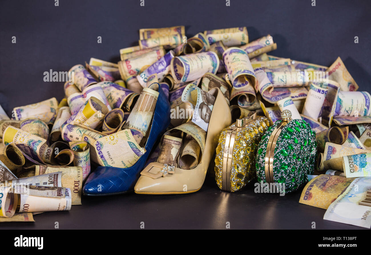 women bag and shoe in naira cash notes Stock Photo