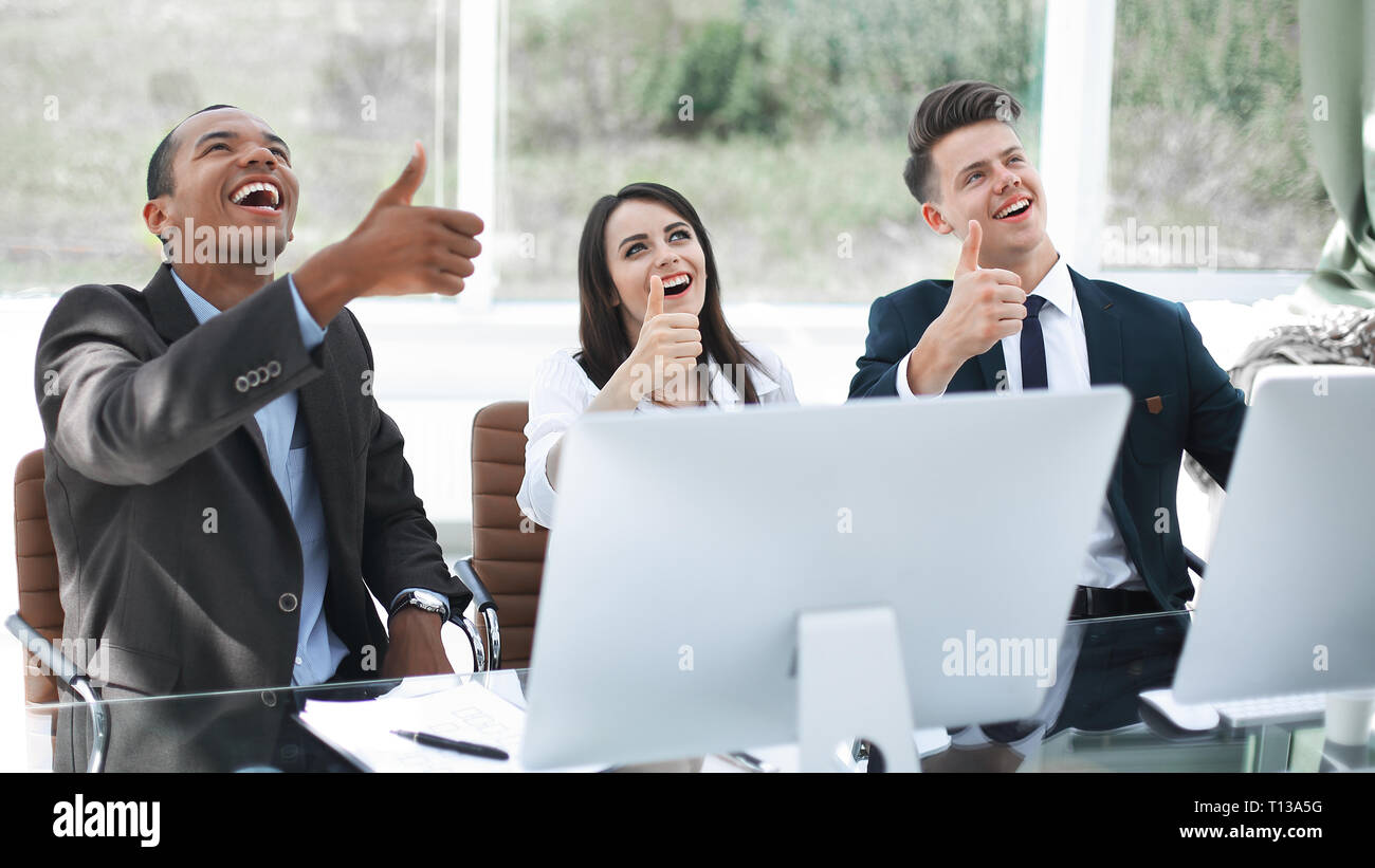 successful international business team showing thumbs up Stock Photo