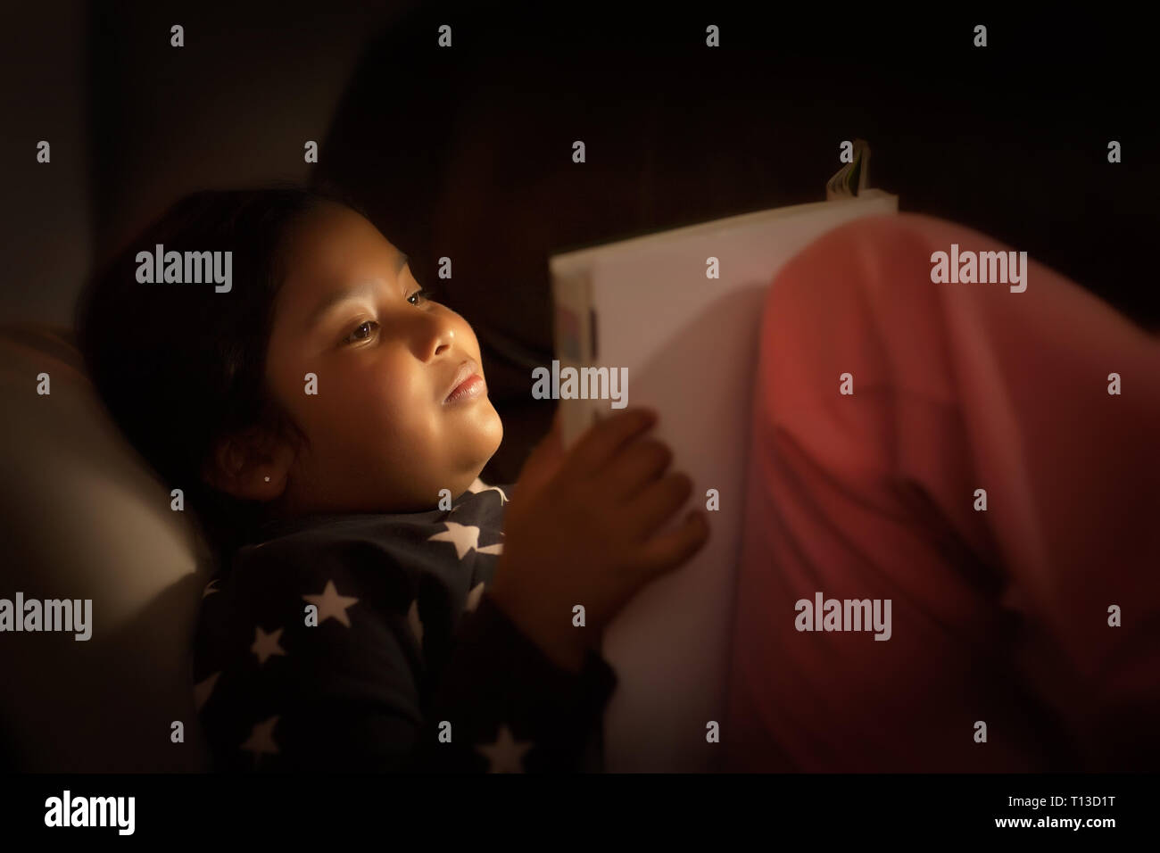 Indian girl reading book hi-res stock photography and images - Alamy
