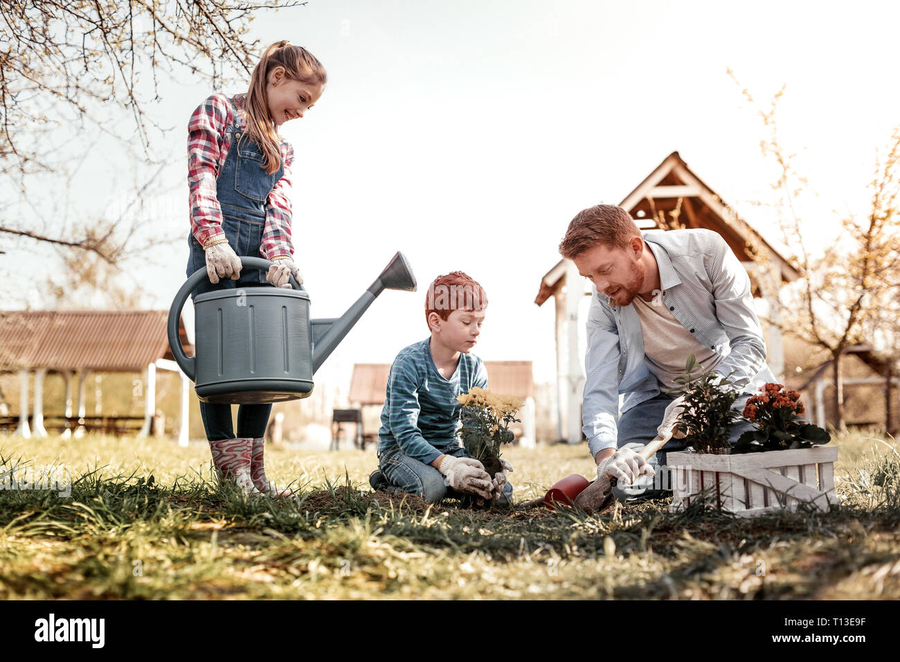 Girl and boy watering plants hi-res stock photography and images - Alamy