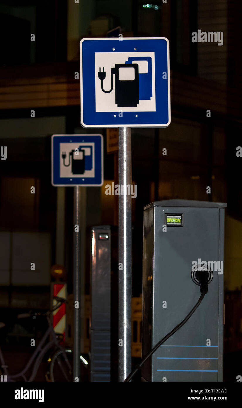 Plug and socket in an electric car hires stock photography and images