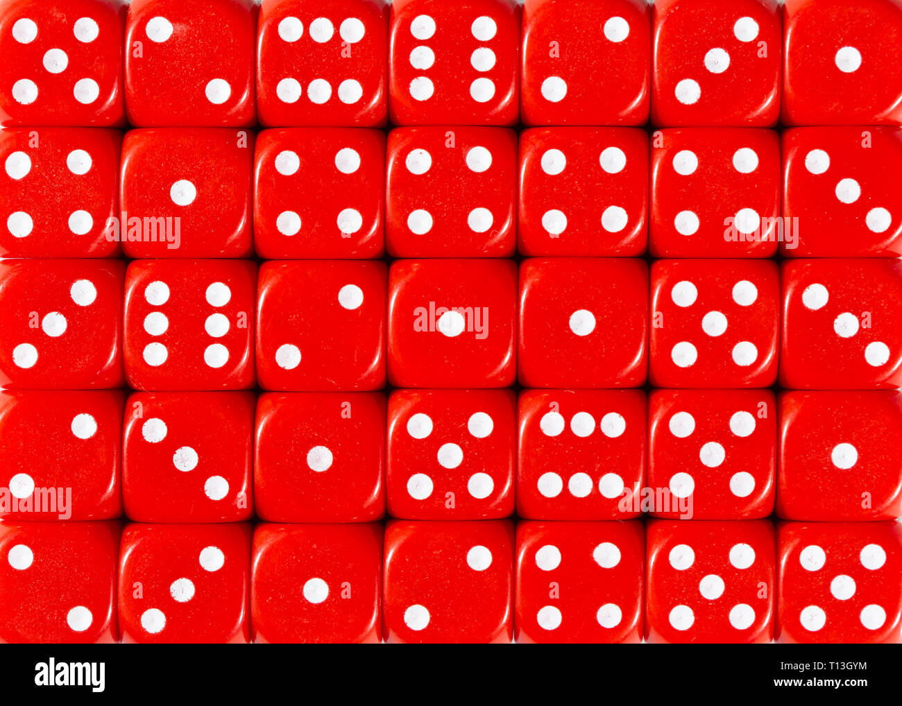 Background pattern of red dices, random ordered Stock Photo