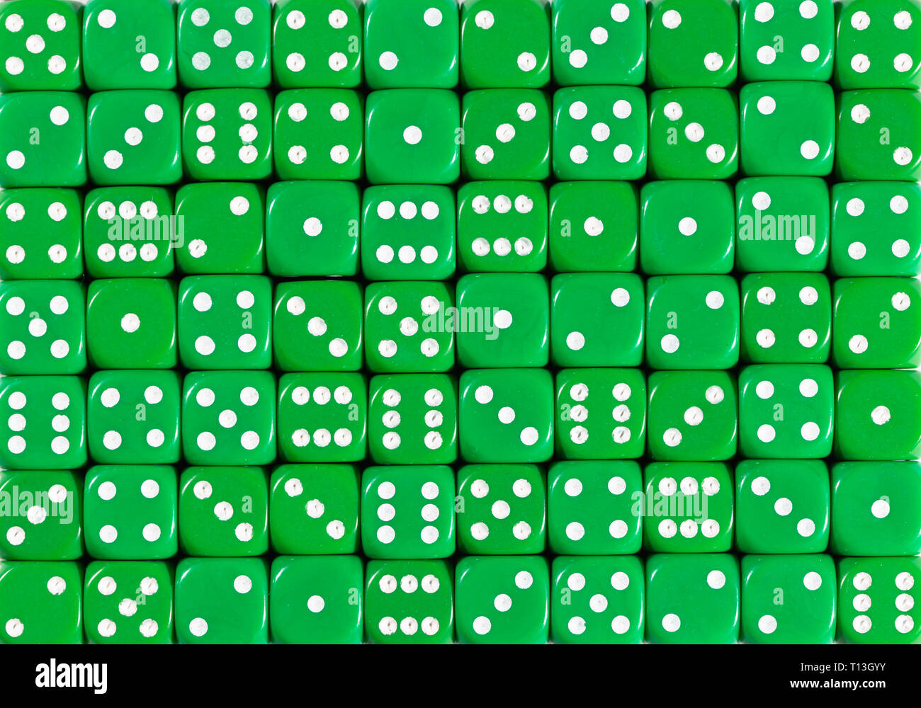 Background pattern of 70 green dices, random ordered Stock Photo
