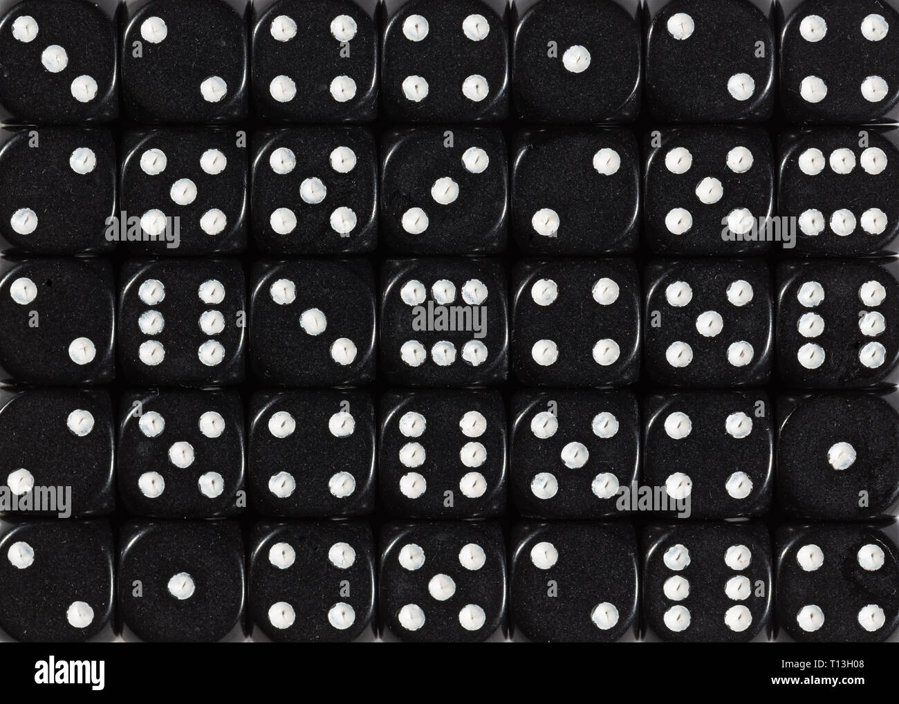 Background pattern of black dices, random ordered Stock Photo