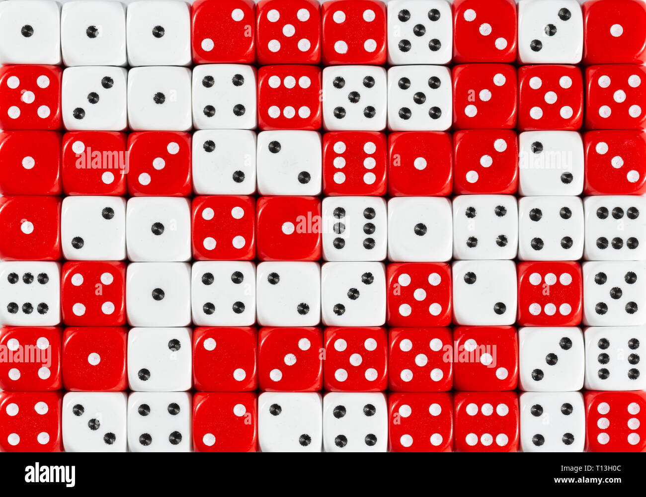Background of 70 random ordered white and red dices Stock Photo