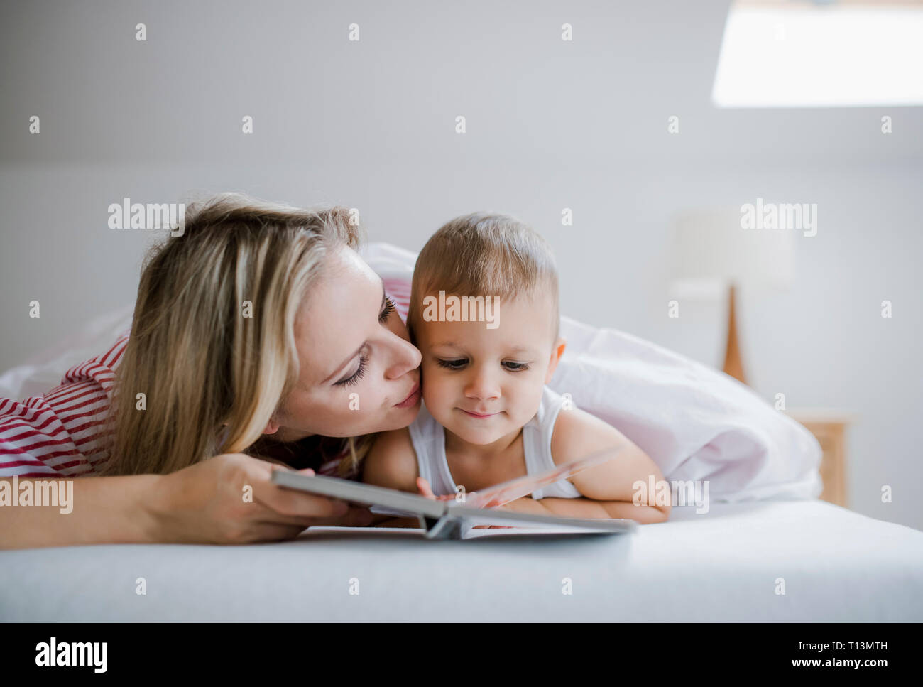 Son kissing mother in bed hires stock photography and images Alamy