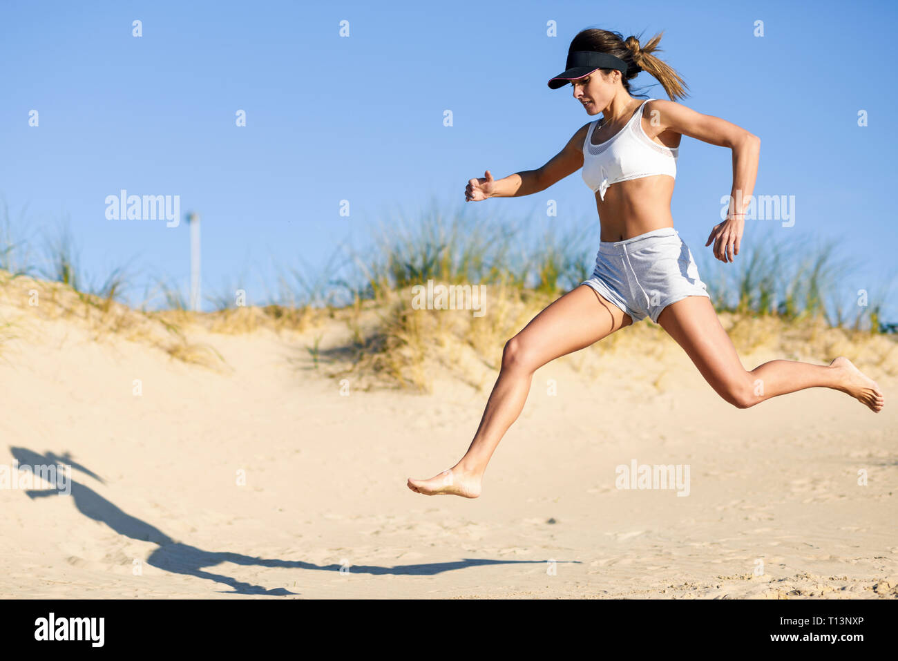 Running along beach hi-res stock photography and images - Alamy