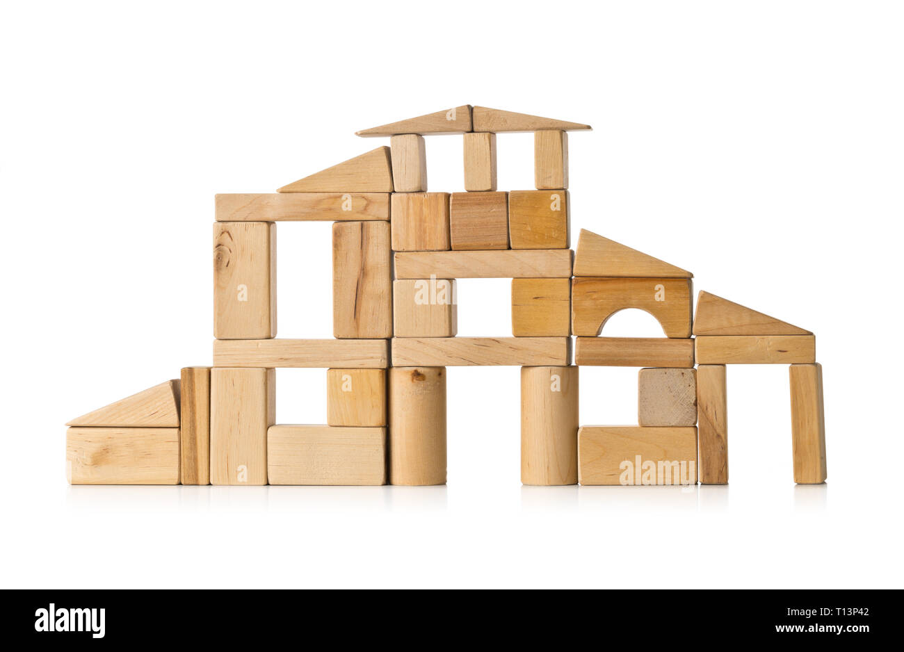 House Build From Wooden Building Block Pieces Over White