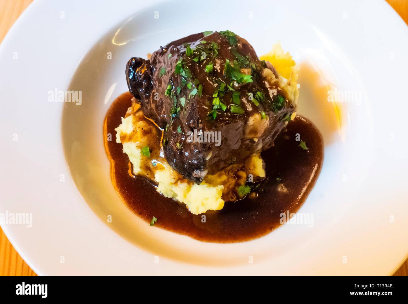 Braised beef with mashed potatoes and a dark gravy Stock Photo