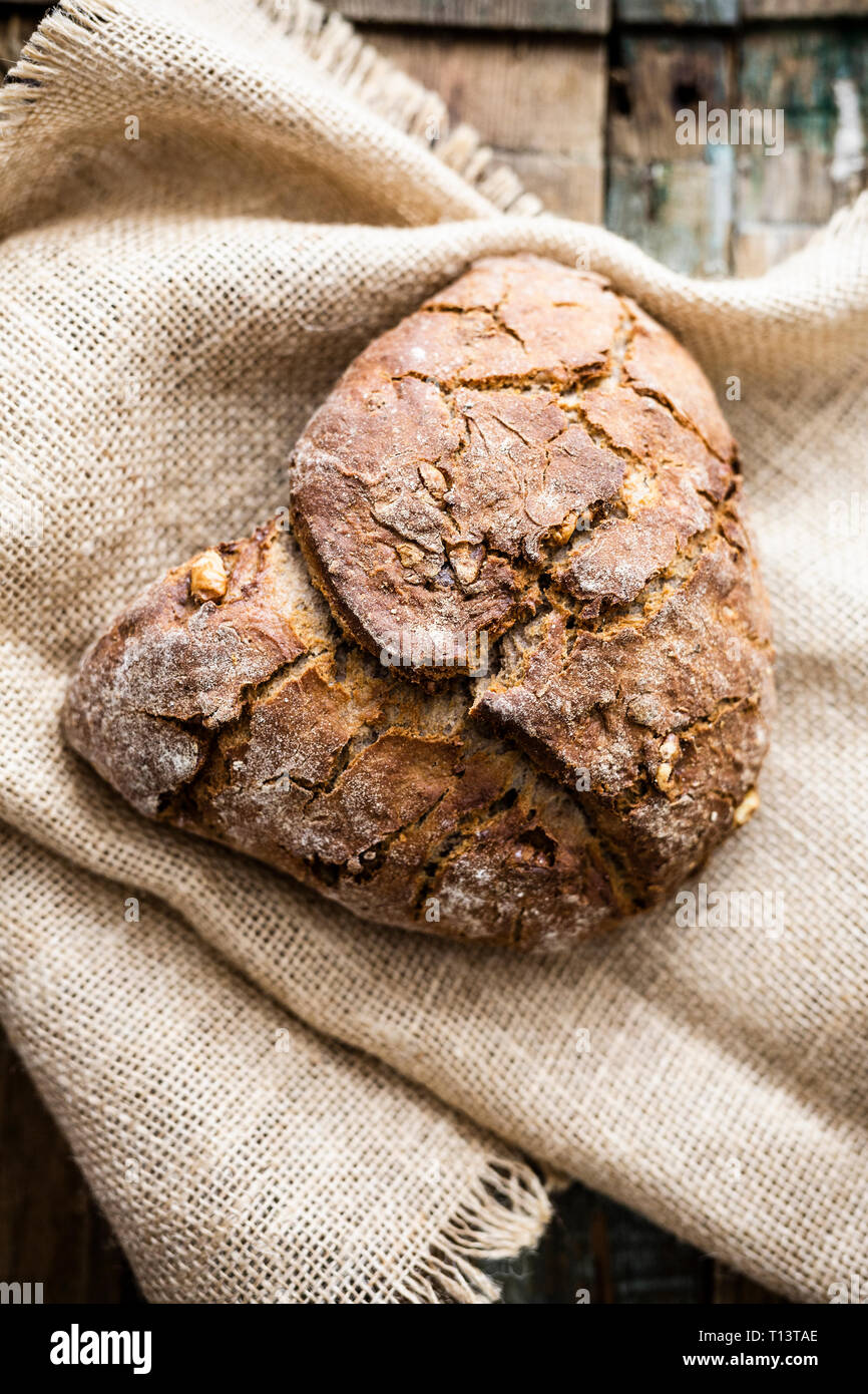 Wholemeal bread with walnuts on jute Stock Photo Alamy