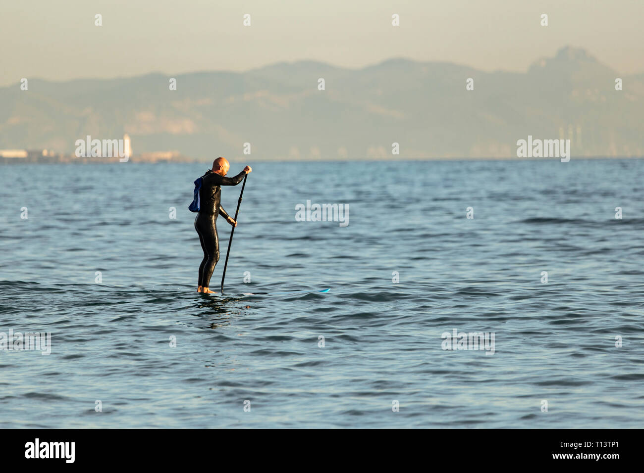 Spain, Andalusia, Tarifa, man stand up paddle boarding on the sea Stock Photo
