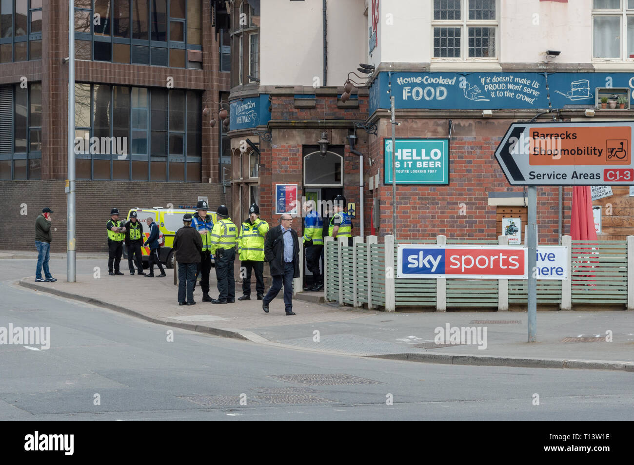 Police presence at a Coventry City center pub on a Saturday afternoon. Stock Photo