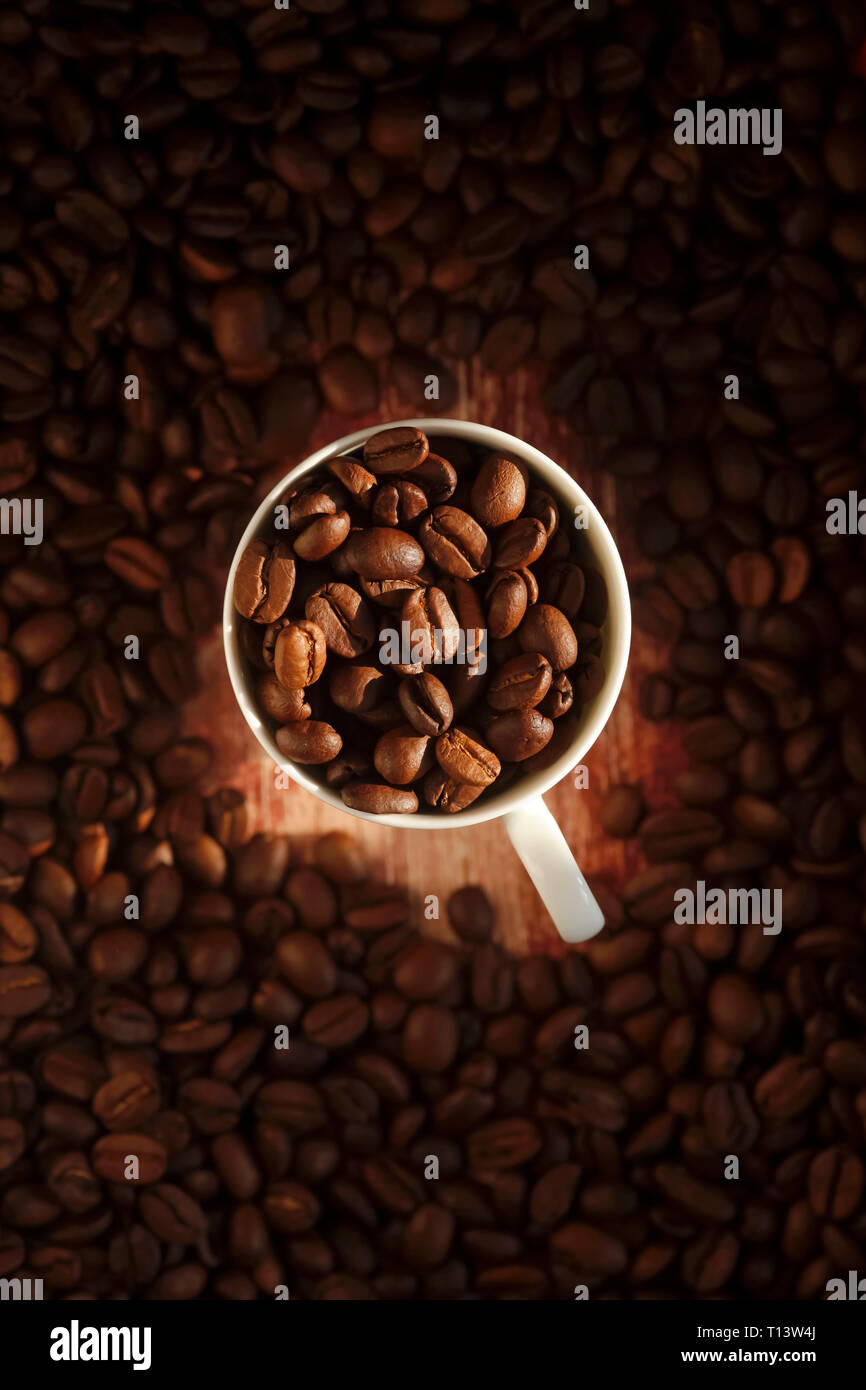 Cup of roasted coffee beans Stock Photo