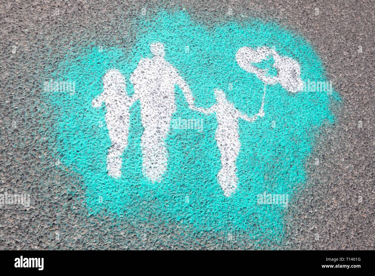 Ostritz, Germany. 23rd Mar, 2019. On the market square the logo of the peace festival was painted on the street with chalk. 'The many little ones can change the face of the world.' it says. With this further peace festival, Ostritz wants to respond to a new meeting of neo-Nazis in the East Saxon city. A right rock concert with about 450 participants is announced for today's Saturday. Credit: Daniel Schäfer/dpa/Alamy Live News Stock Photo
