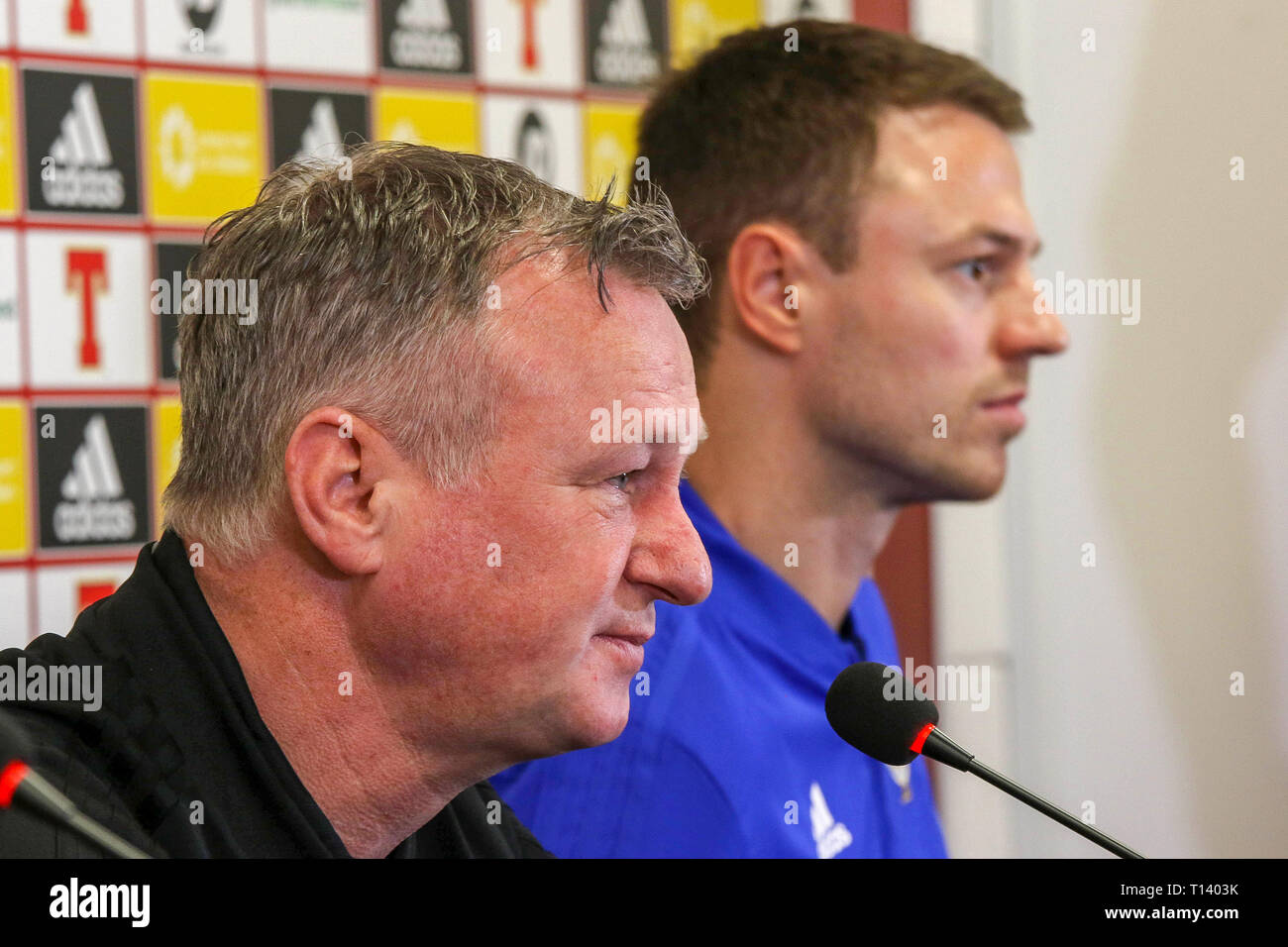 Windsor Park, Belfast, Northern, Ireland. 23rd Mar, 2019. Northern Ireland manager Michael O'Neill (l) and Jonny Evans at today's press conference in Belfast. Northern Ireland play Belarus at Windsor Park tomorrow evening in their second UEFA EURO 2020 Qualifying game. On Friday night Northern Ireland defeated Estonia 2-0 in their first qualifying game. Credit: David Hunter/Alamy Live News Stock Photo