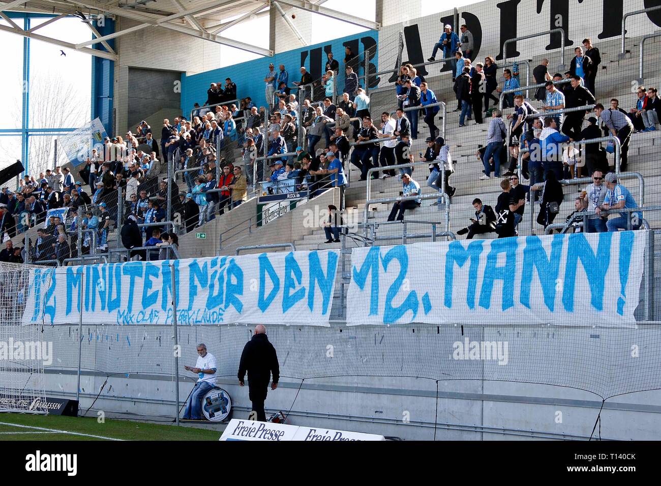 Chemnitz, Germany. 23rd Mar, 2019. Soccer: Regionalliga Nordost, 26th  matchday Chemnitzer FC - FSV Budissa Bautzen in the stadium at  Gellertstrasse. Action of the Ultras Chemnitz 99 with a banner with the