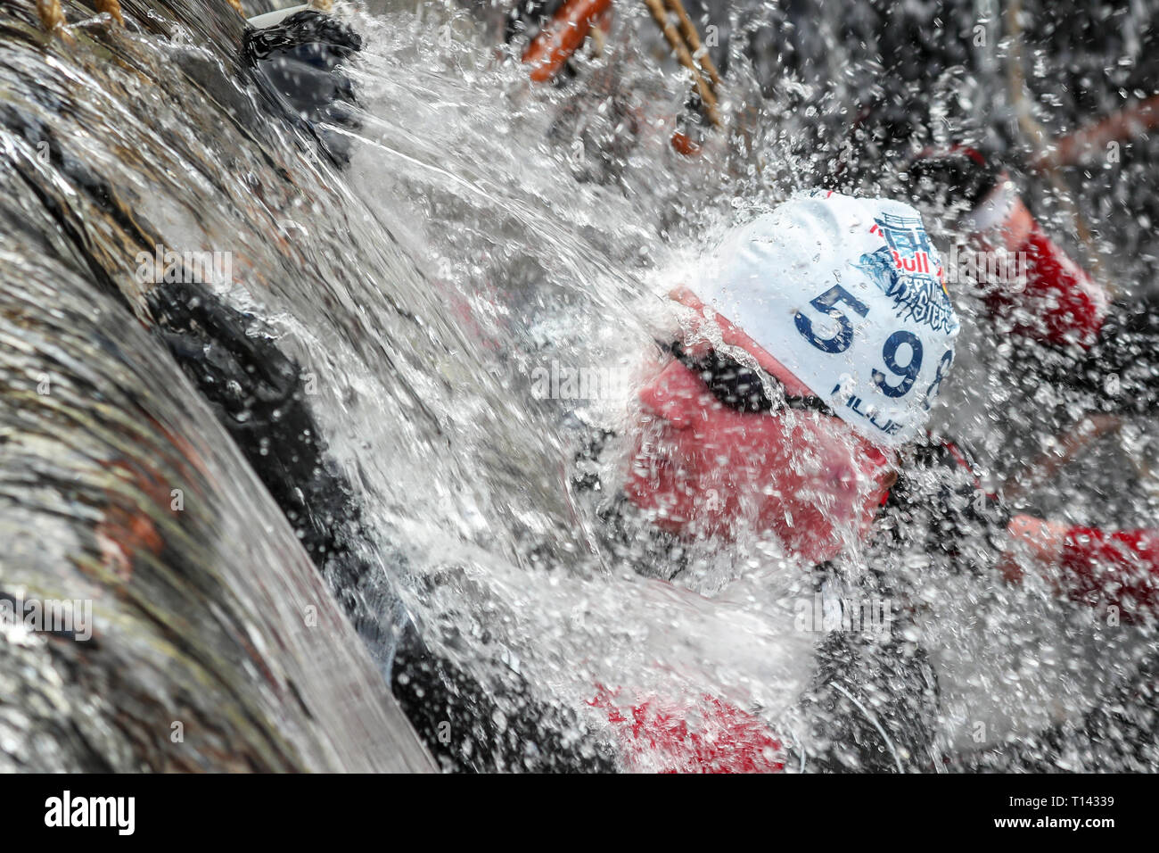 Glasgow, Scotland, UK. 23rd March, 2019. 600 hundred international competitors took part in the annual Red Bull Neptune Steps Cold Water race along 5 locks of the Clyde and Forth Canal at Maryhill, known as Neptune Steps, Glasgow, UK. Thee competitors had to swim the canal, climb ropes and specially constructed obstacle walls to complete the course in water temperatures of up to 8 degrees centigrade. Credit: Findlay/Alamy Live News Stock Photo