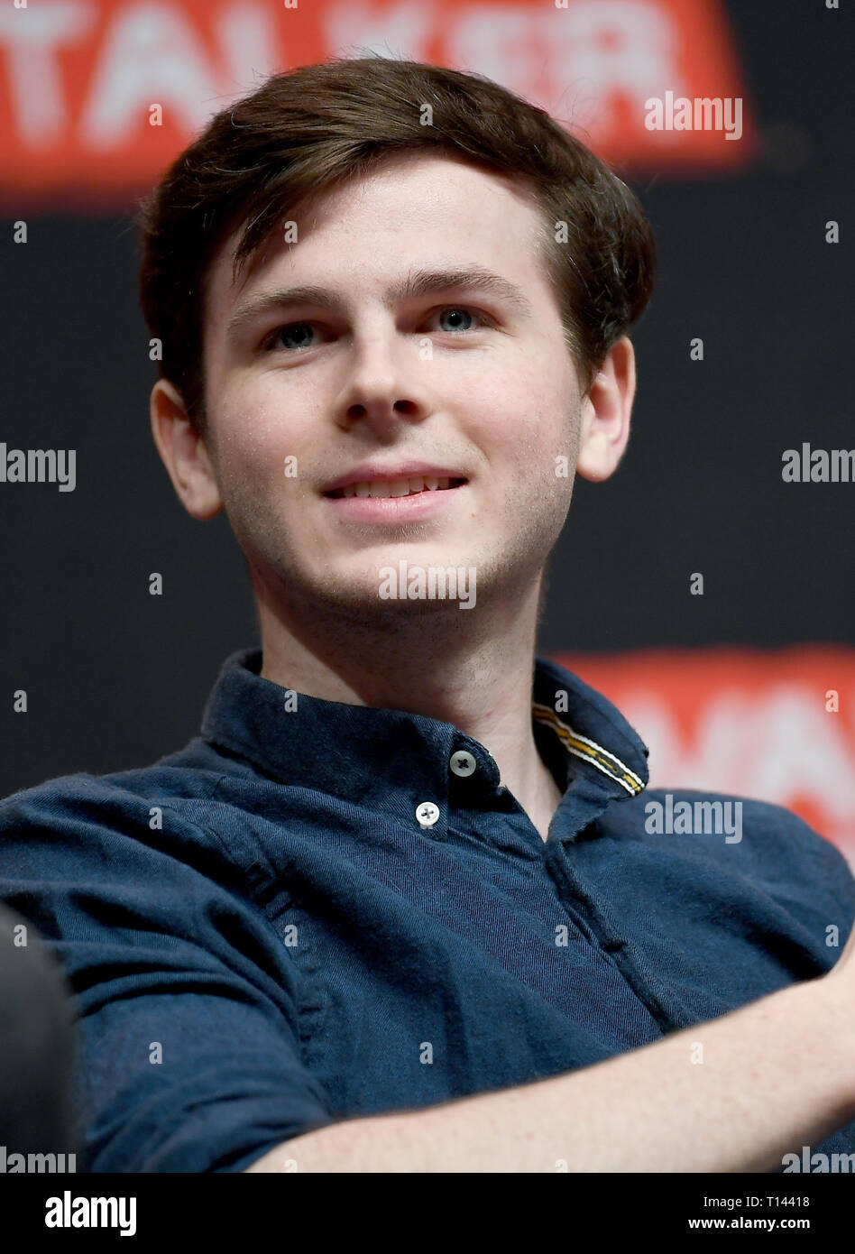 Berlin Germany 23rd Mar 2019 The American Actor Chandler Riggs Known For His Role As Carl Grimes In The Series The Walking Dead Sits On The Walker Stalker Con At Messe Berlin