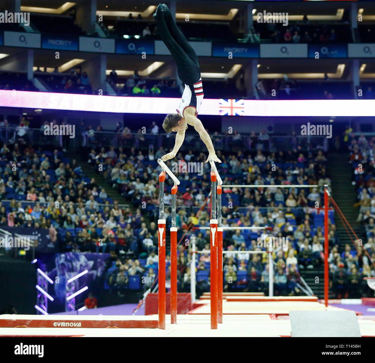 London, UK. 23rd Mar, 2019. London, 23 March, 2019 Sam Oldham on Men's Parallel Bars during The Superstars of Gymnastics at 02 Areana, London, England on 23 Mar 2019. Credit: Action Foto Sport/Alamy Live News Stock Photo