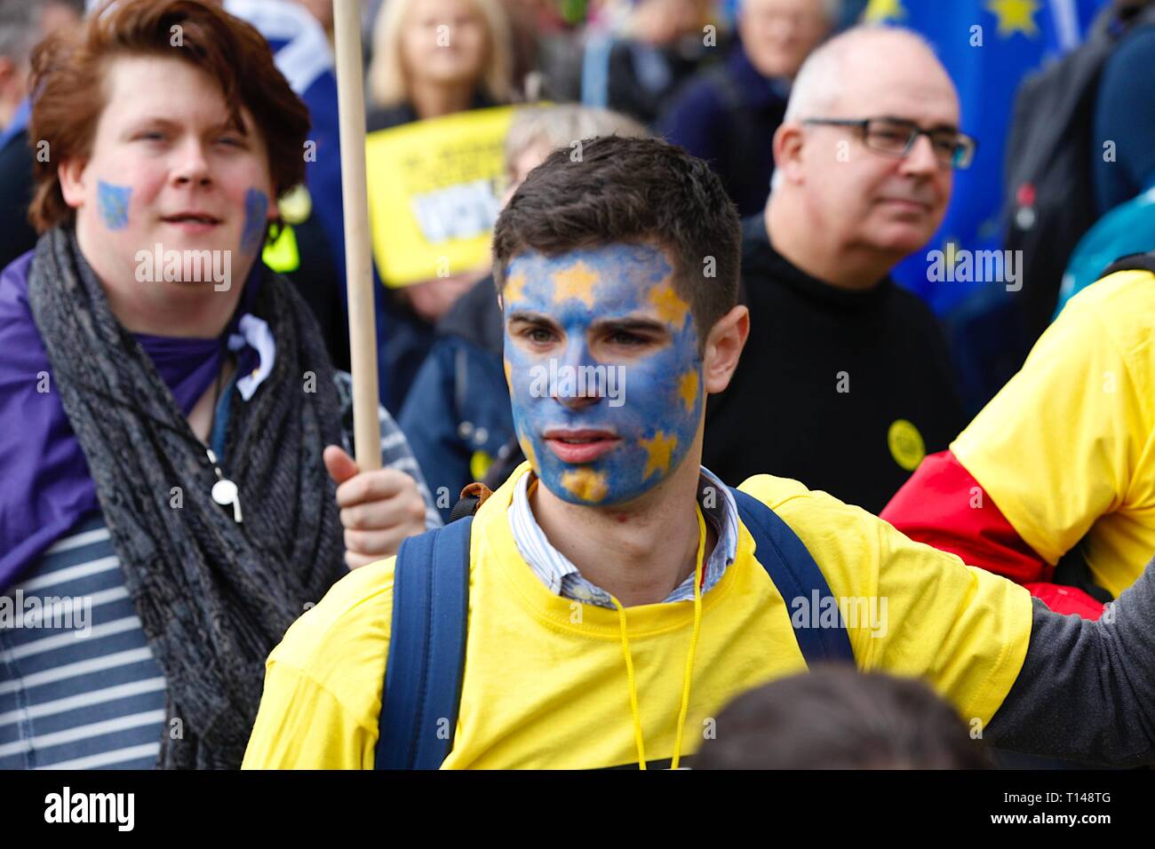 London, UK. 23 Mar, 2019. People’s Vote March: Hundreds of thousands of pro-EU supporters attend a mass march to Westminster. People are expected to join the march from Park Lane to Parliament Square beginning at noon with speeches commencing at 2.45pm from all political party’s. A young man with a painted EU flag face. ©Paul Lawrenson 2019, Photo Credit: Paul Lawrenson/Alamy Live News Stock Photo