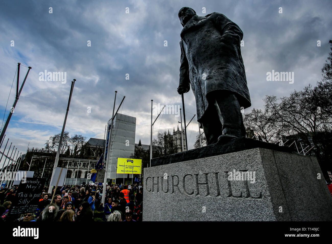 The statue or Winston Churchill overlooks a large crowd on parliament square,The People's Vote March, London, March 2019 Stock Photo