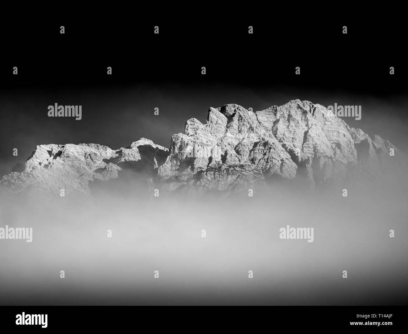 Black and white image of mountain peak with clouds in the alps Stock ...