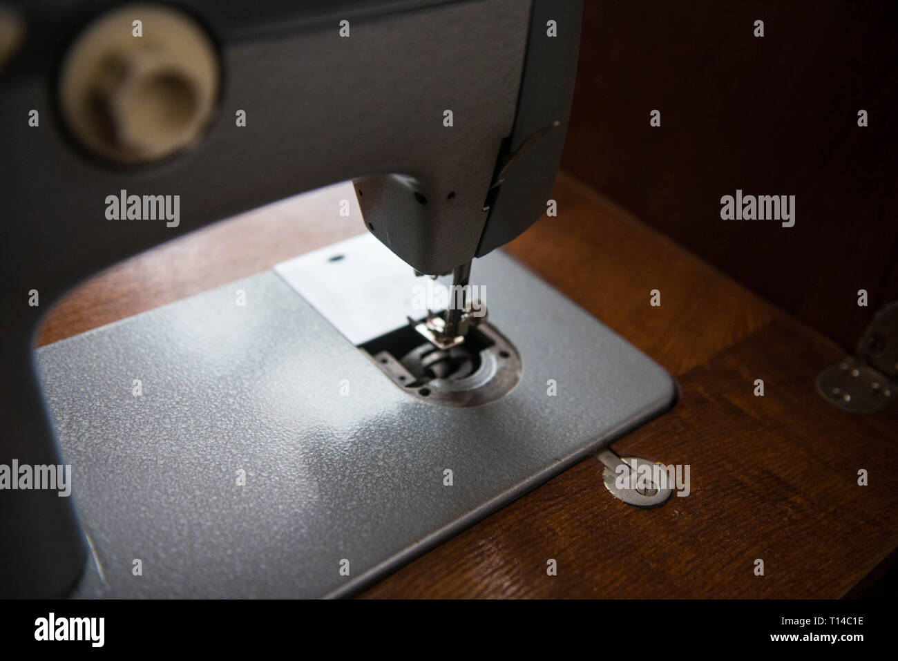 Old manual sewing machine on photo Stock Photo Alamy