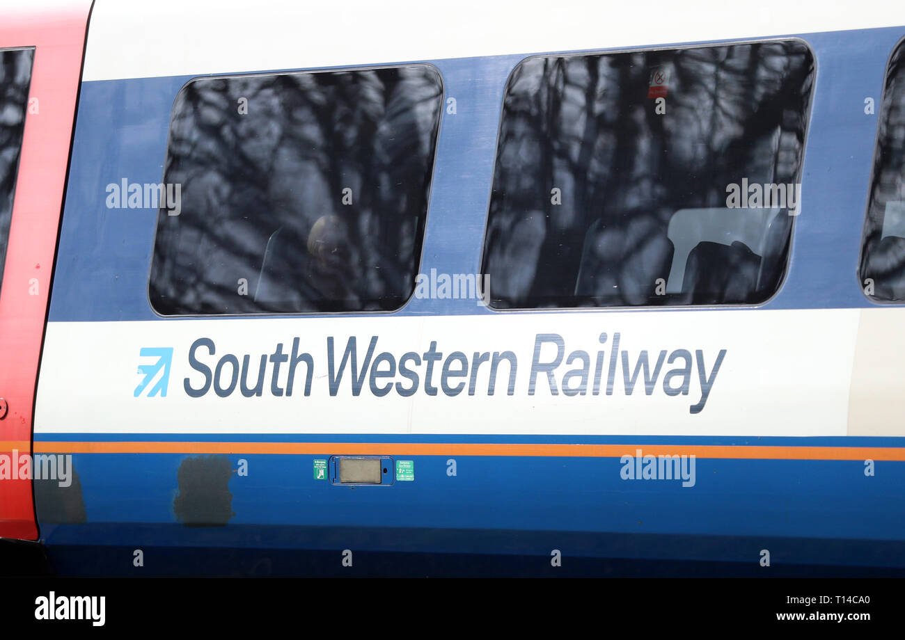 A South Western Railway train makes it's way along the line near to Basingstoke in Hampshire. Stock Photo