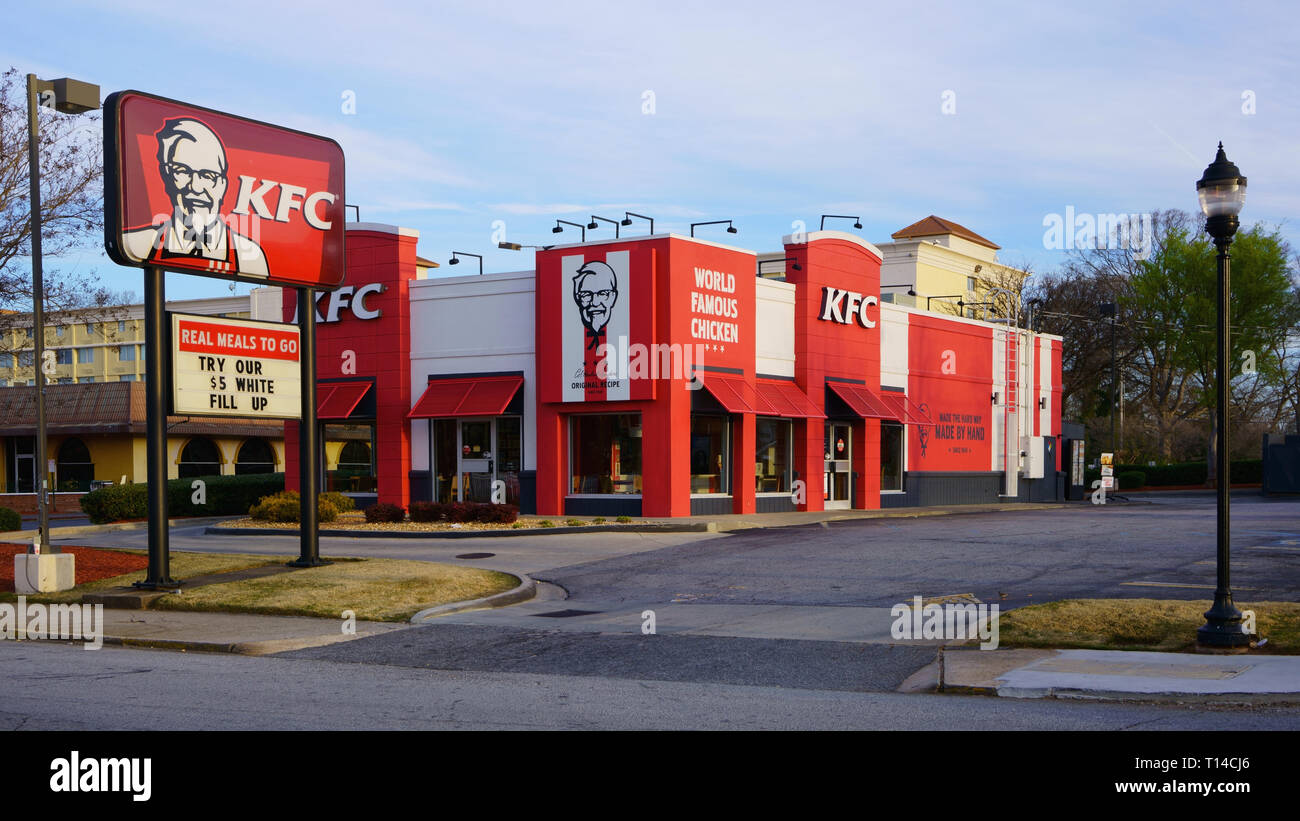 Exterior of KFC Kentucky Fried Chicken fast food restaurant with drive thru. Traditional US American restaurant chain, specializing in fried chicken. Stock Photo
