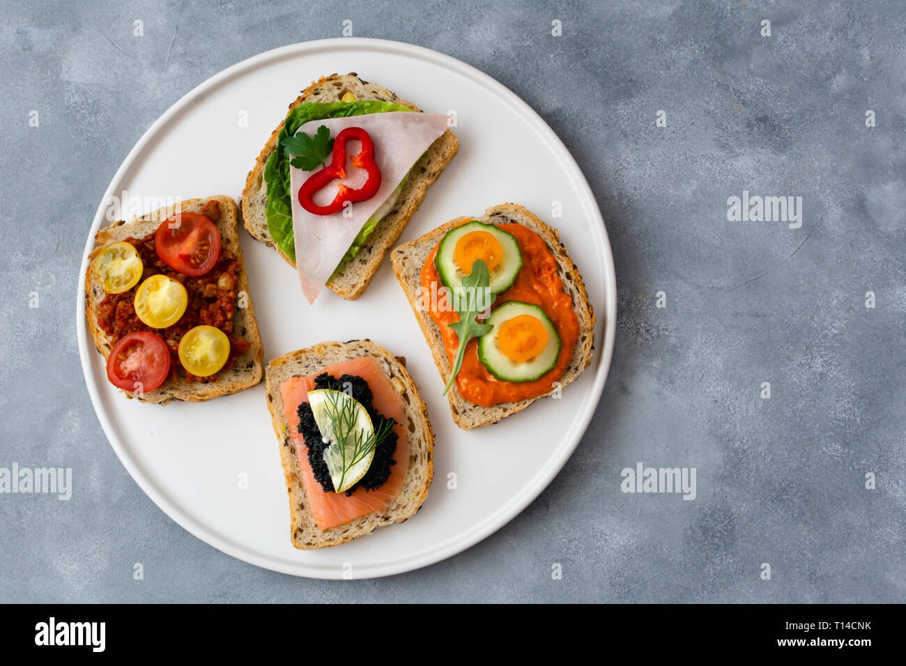 Breakfast toasts with various toppings. Healthy bruschetta. Bread
