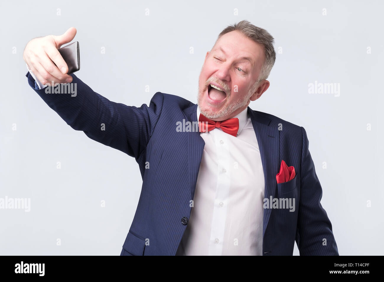 Senior man making a selfie by phone Stock Photo